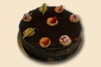 Tort okrągły o dowolnym smaku kremu oblany ciemną czekoladą #2